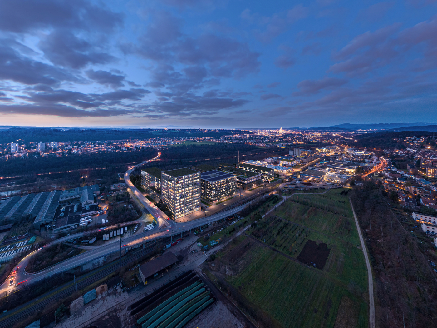Fotos vom Areal, uptownBasel ist ein internationales Kompetenzzentrum für Industrie 4.0. Innerhalb der nächsten 10 Jahre entstehen auf über 70'000 Quadratmetern neun Gebäude für 50 internationale Unternehmen und rund 2’500 Arbeitsplätze. © Copyright | Digitale Medienmappe «Offizielle Eröffnung von uptownBasel, dem internationalen Kompetenzzentrum für Industrie 4.0», uptownBasel